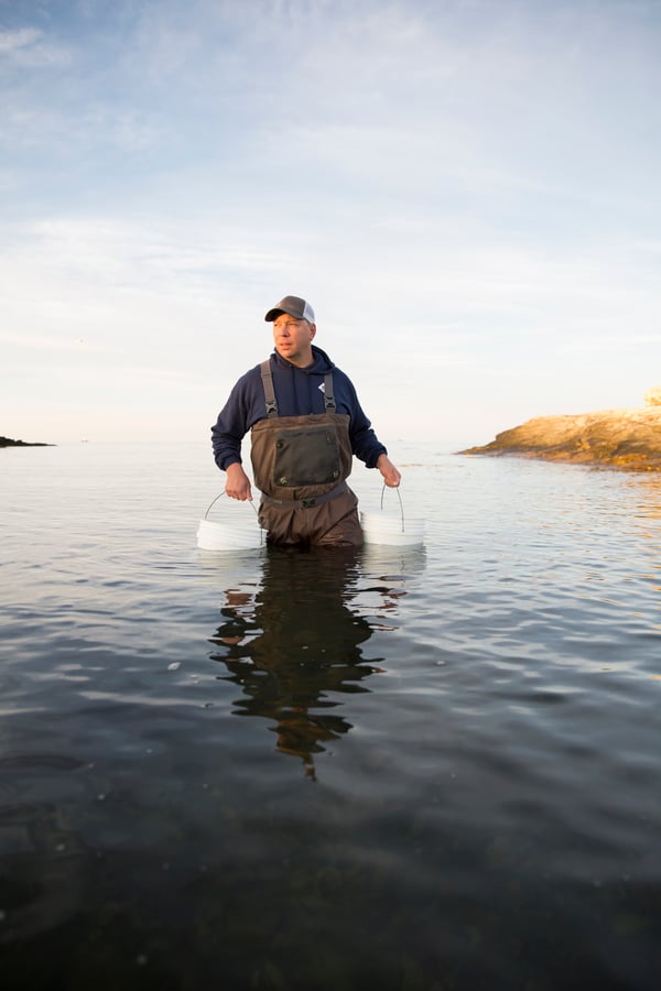 Matt gathers bucket of seawater.