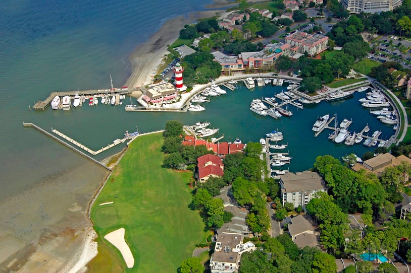 Boats docked near the lighthouse of Manteo Waterfront Marina