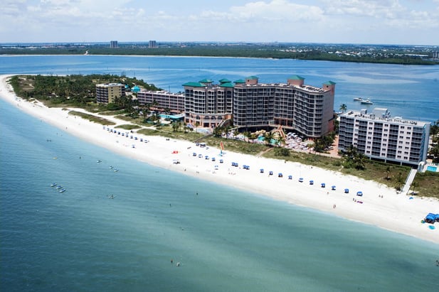 Aerial view of the white sandy beaches of the Pink Shell Beach Marina & Resort