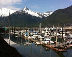 A marina in front of a mountain range